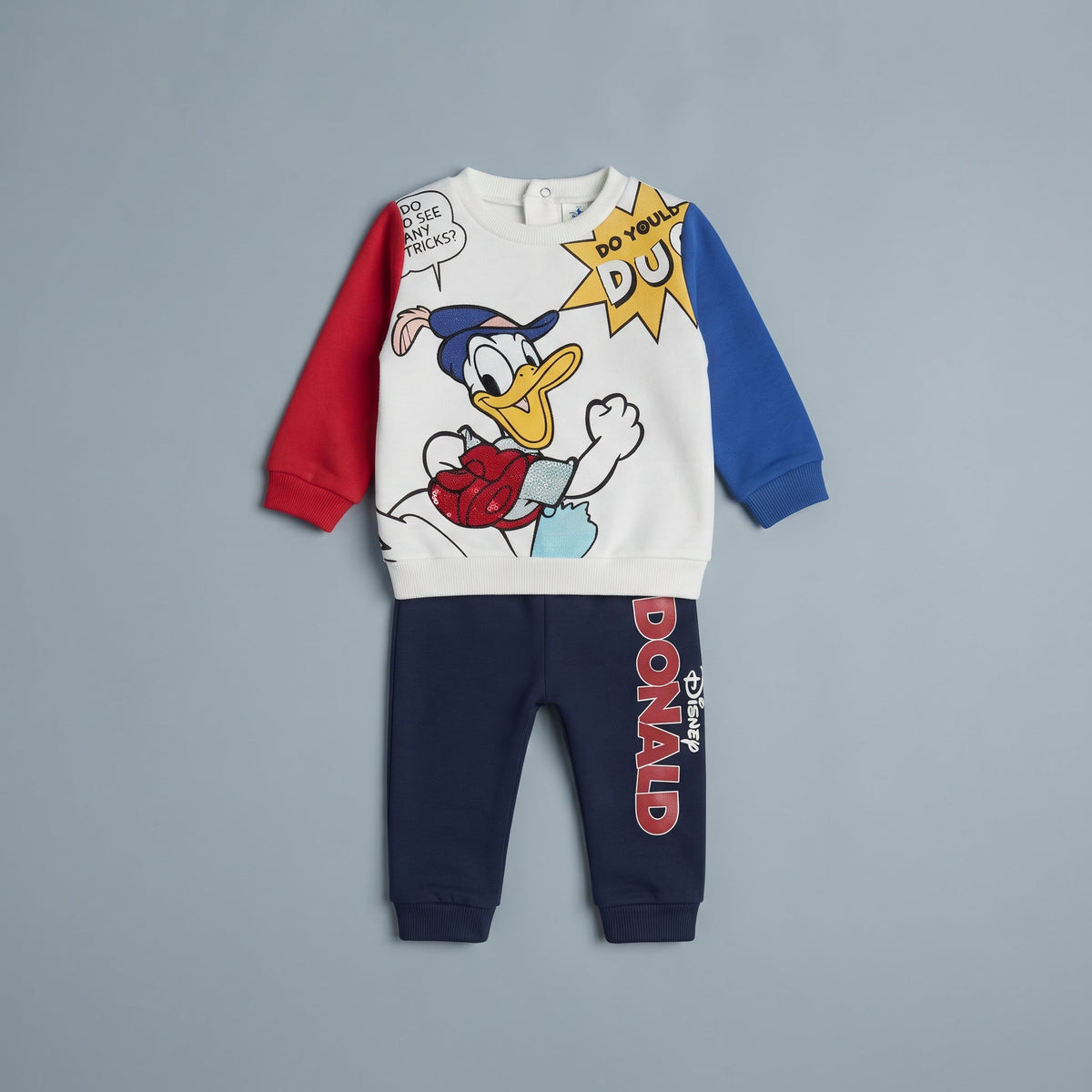 Conjunto EmpiBy de dos piezas para bebé niño con sudadera blanca del Pato Donald y pantalón jogger azul marino