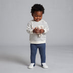 Bebé con conjunto EmpiBy de sudadera a rayas blancas y azul marino con orejas de conejo y legging denim azul