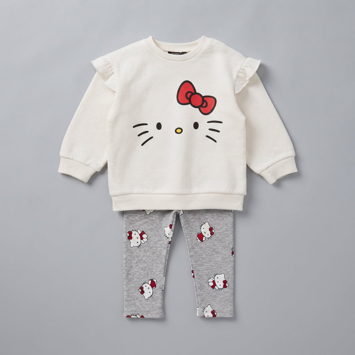Conjunto EmpiBy de dos piezas para niña con sudadera marfil de Hello Kitty y leggings grises estampados