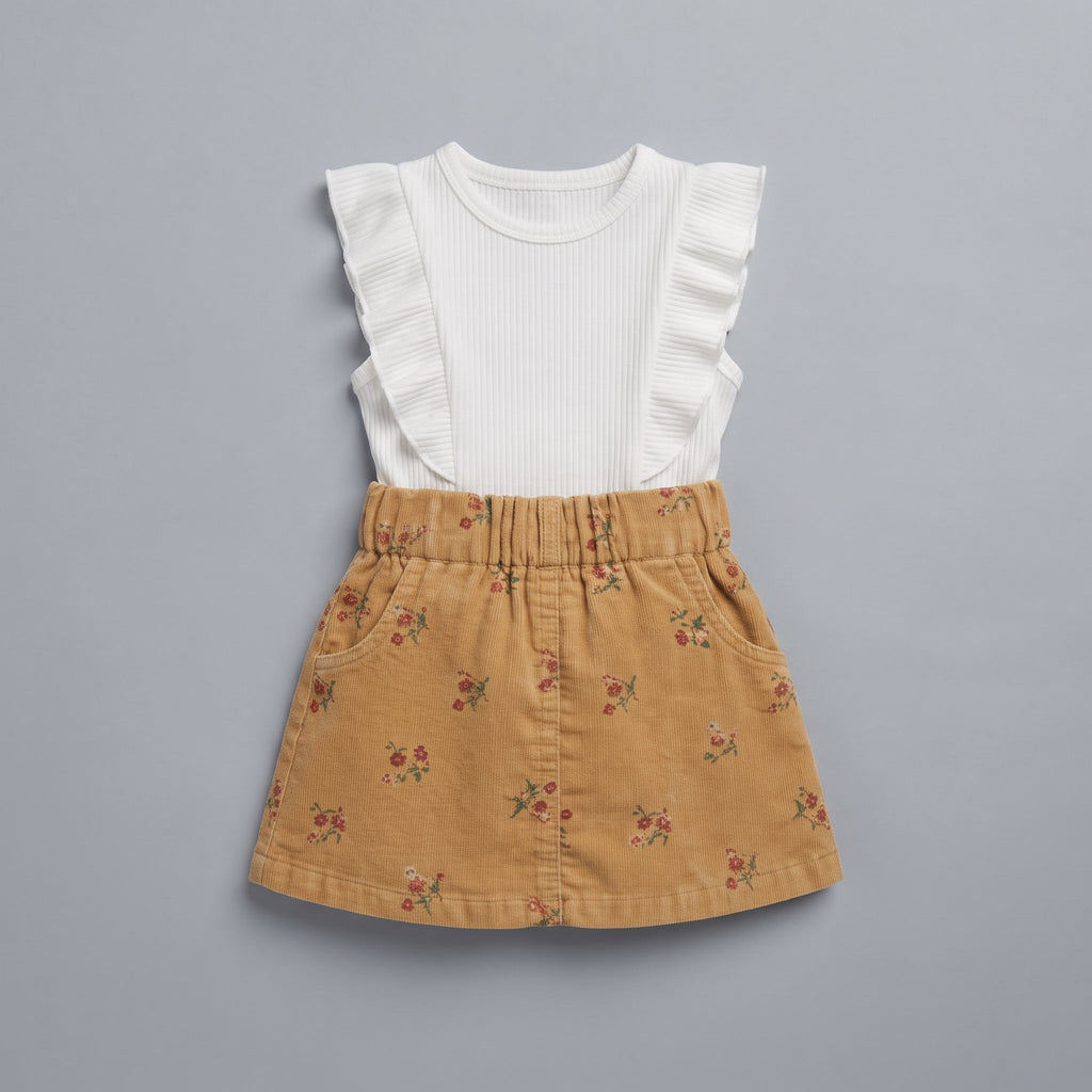 Conjunto EmpiBy de 2 piezas para niña con falda de pana mostaza floral y camiseta blanca de canalé con volantes