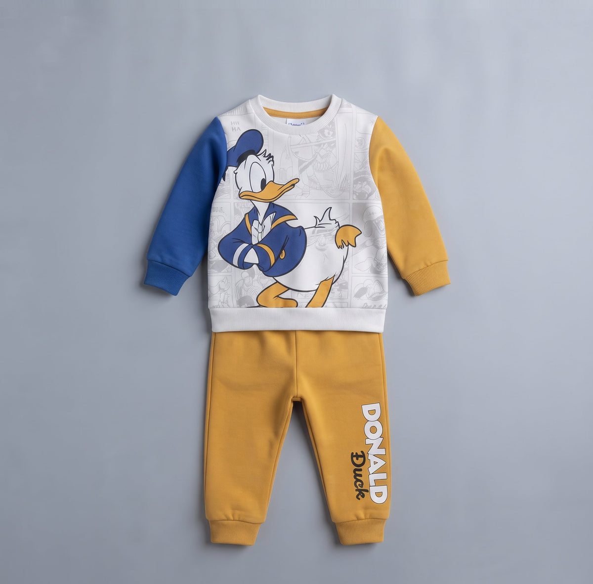 Conjunto EmpiBy de dos piezas para bebé con sudadera del Pato Donald, mangas azul y mostaza y pantalón jogger a juego