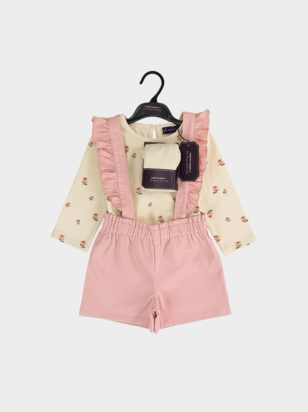Conjunto EmpiBy de peto rosa de pana con volantes y camiseta de manga larga color crema con estampado floral