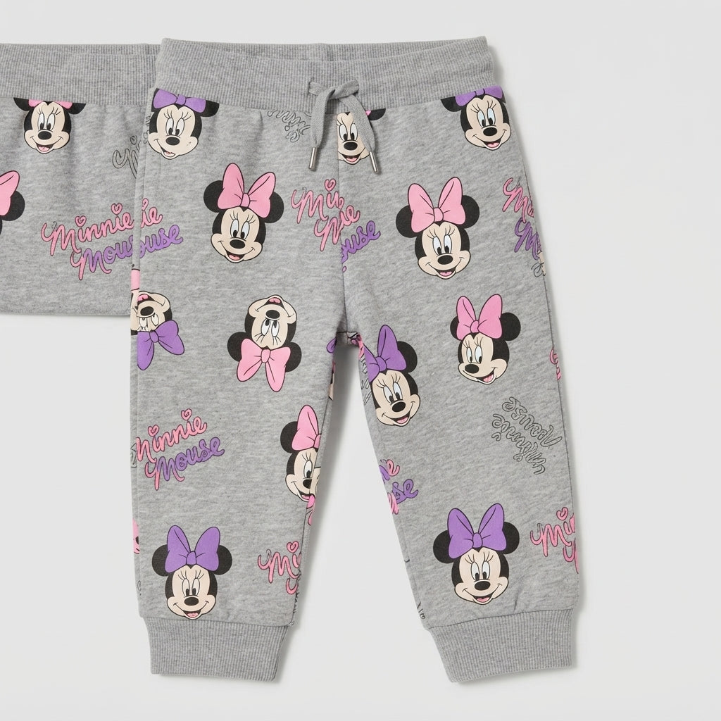 Pantalones infantiles EmpiBy de color gris con estampado de Minnie Mouse y lazos rosas y morados