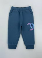 Pantalón jogger azul EmpiBy de Stitch con cintura elástica y estampado lateral del personaje para niños