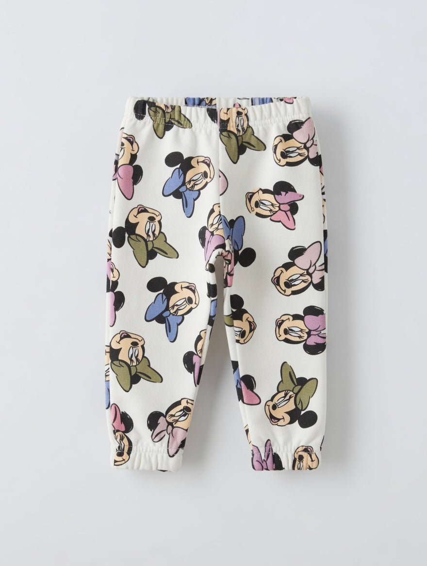 Pantalones de chándal EmpiBy para niña en color crema con estampado integral de caras de Minnie Mouse
