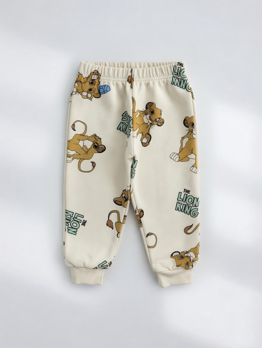 Pantalones de chándal EmpiBy color crema con estampado de Simba de El Rey León y puños elásticos