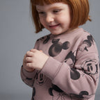 Niña con sudadera EmpiBy de color malva con estampado de Minnie Mouse y cuello redondo