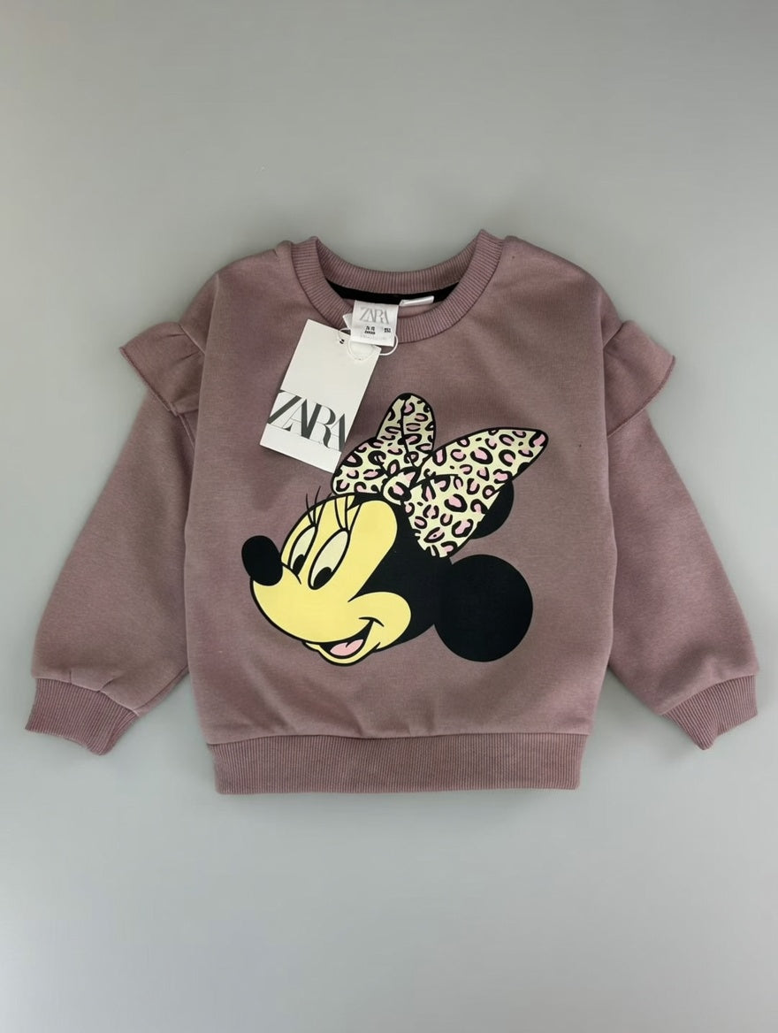 Sudadera EmpiBy de Minnie Mouse en color malva con estampado de lazo animal print y volantes en los hombros