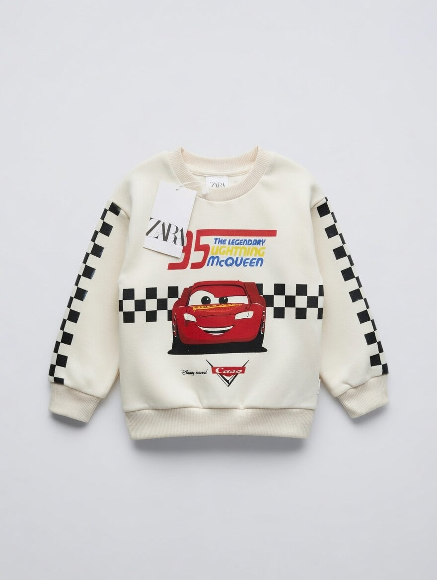 Sudadera EmpiBy de Rayo McQueen en color crema con estampado de carreras y detalles a cuadros en las mangas