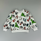 Sudadera EmpiBy blanca con estampado de Spidey y sus amigos, cuello redondo y puños acanalados para niños.