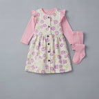 Conjunto EmpiBy de 3 piezas para bebé niña con vestido floral marfil, camiseta rosa de manga larga y medias a juego.